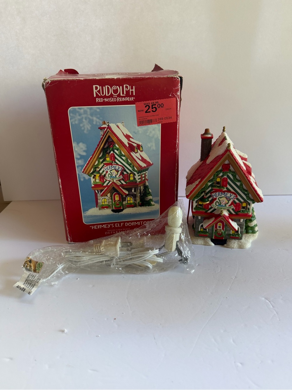 Department 56 Rudolph Hermey's Elf Dormitory - Red, Green, White, Gold